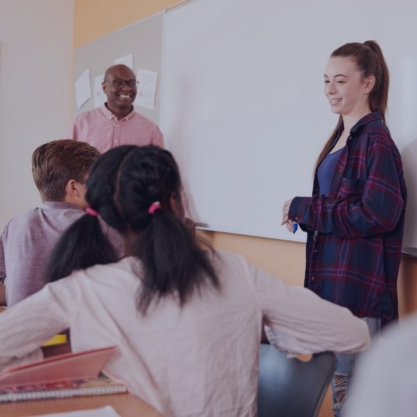 female standing up in front of class