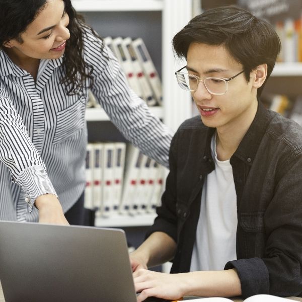 teacher helping student